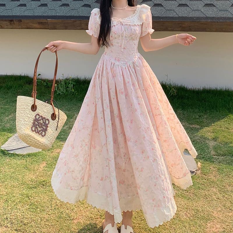 A cute and sophisticated pink floral retro girly dress perfect for plus-size spring outfits.